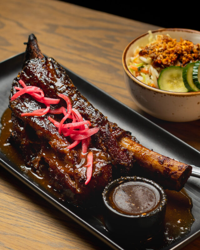 It's hard to capture the sheer scale of this thing.

Our Smoked "Dino" Beef Short Rib arrives slow-smoked, glazed Kalbi-style, topped with pickled onions, and served alongside crunchy peanut slaw.

Bring your appetite.